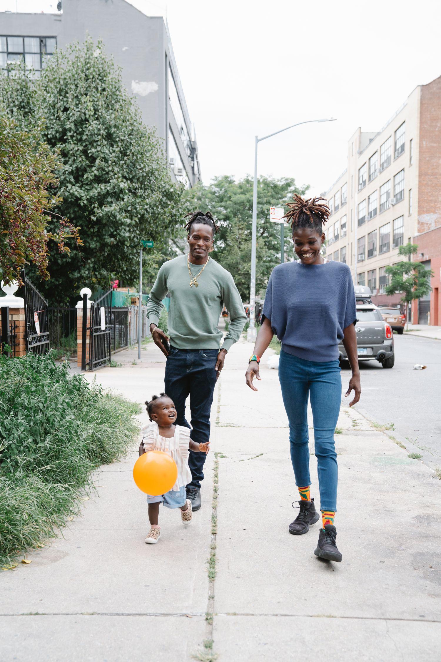 A family smiling and walking together