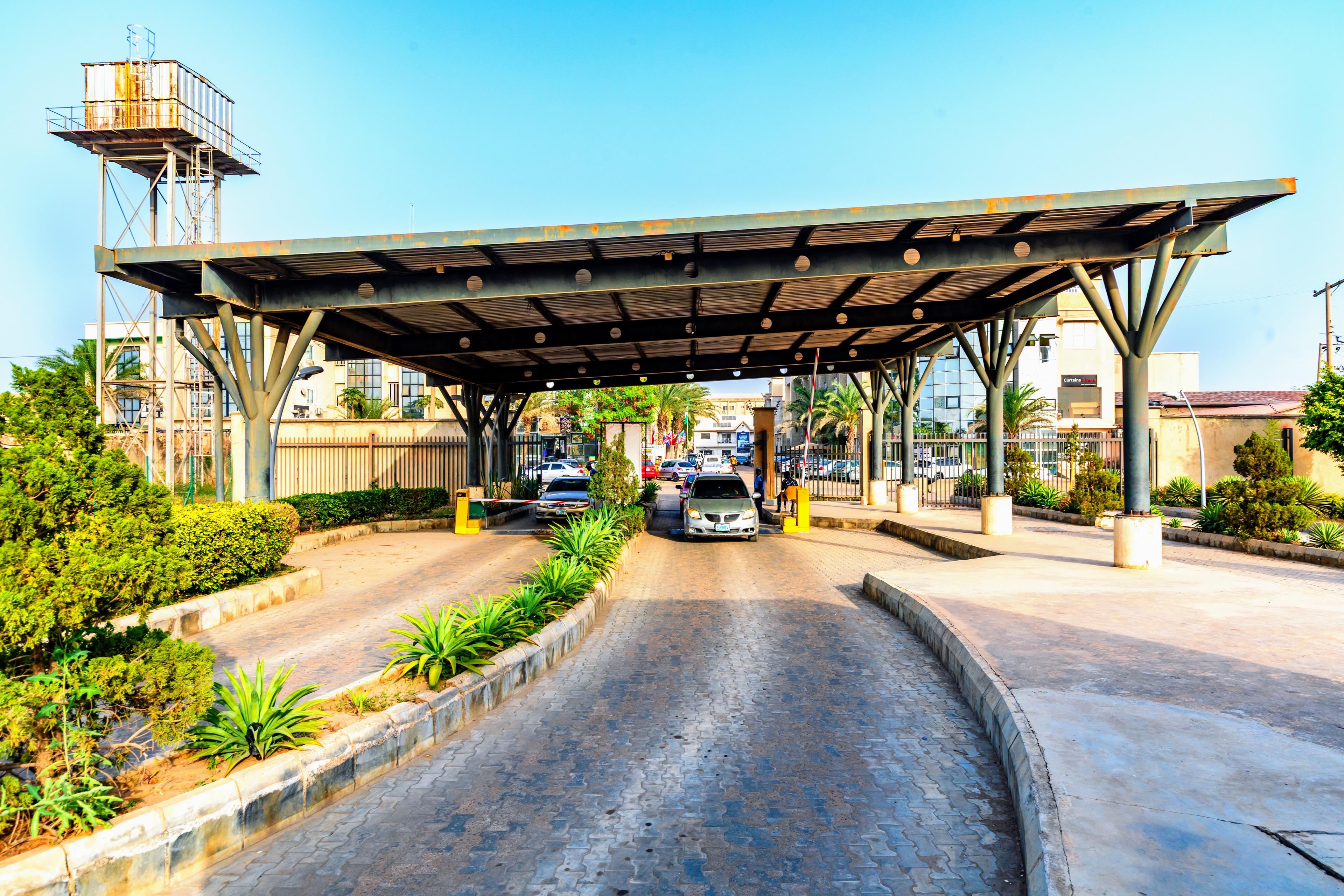 The covered entrance gate and security checkpoint at ABM Mall's car park