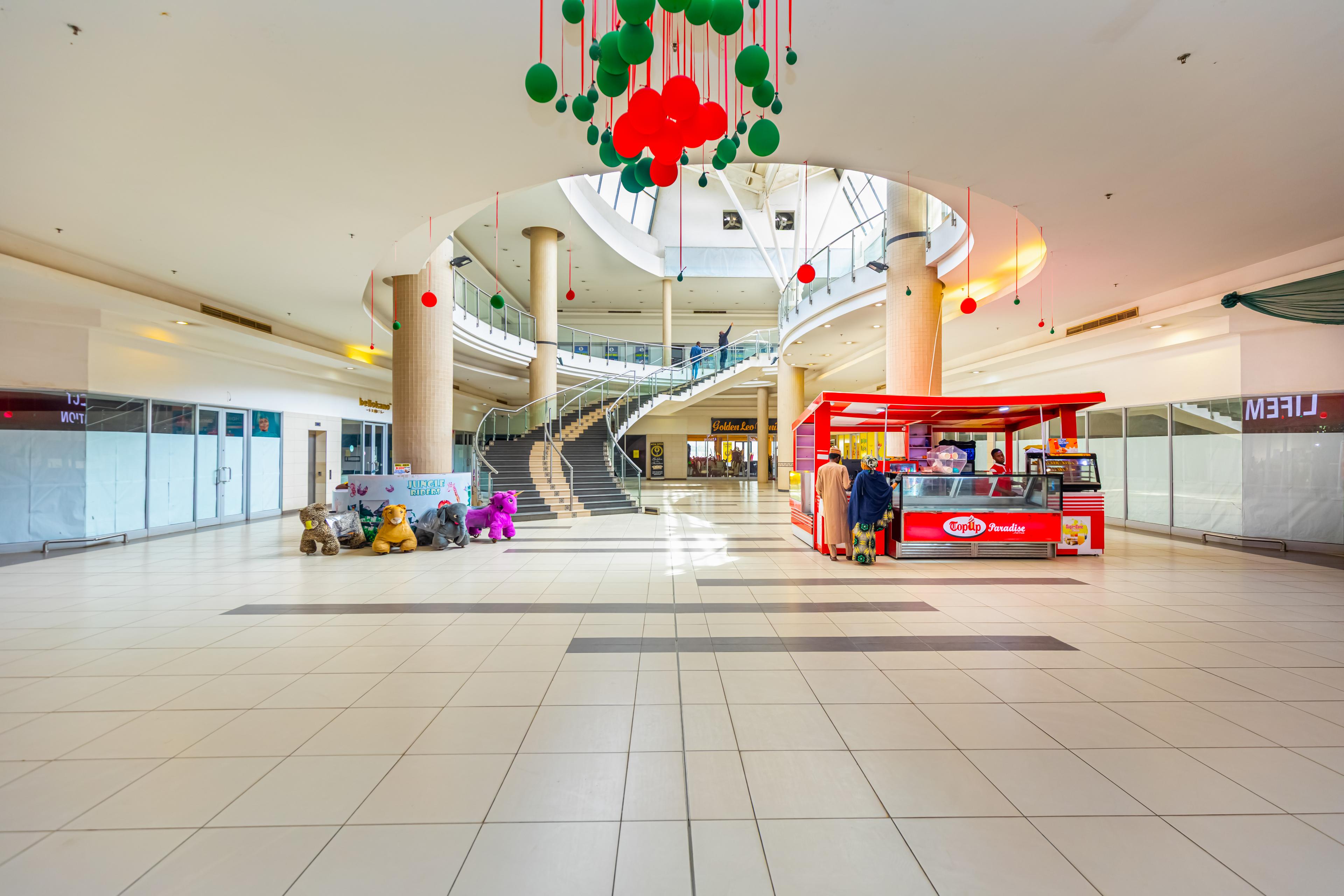 The atrium and storefronts at Ado Bayero Mall
